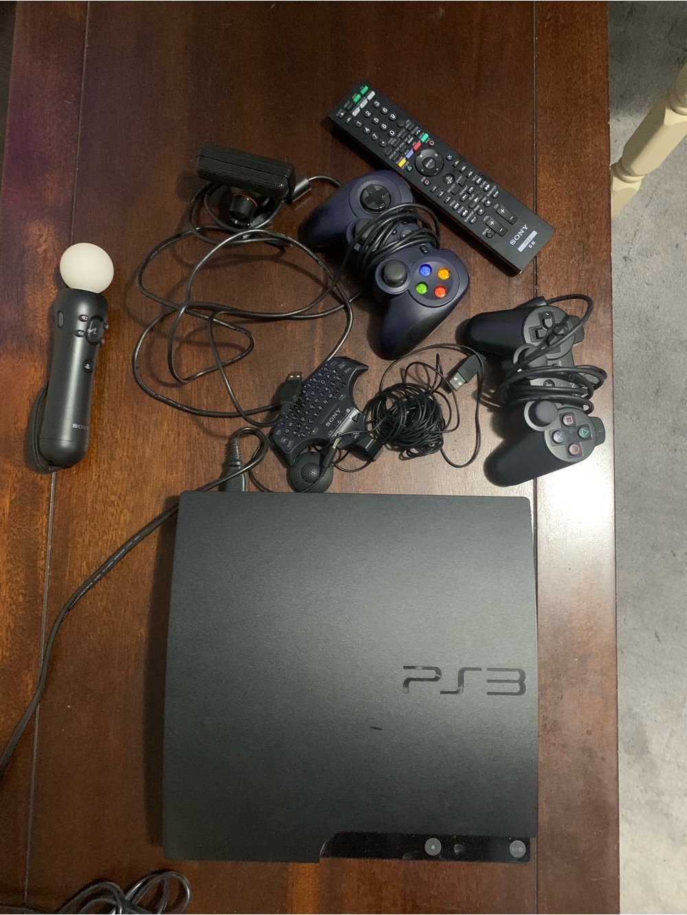 Sony Black PS3 Slim Console with Black Controllers and Motion Controller